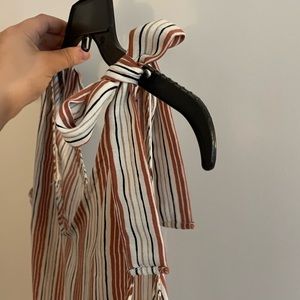 Multi-colored v-neck striped tank top with non-adjustable tying shoulders